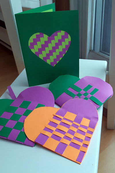 Traditional Scandinavian woven paper heart baskets and a woven heart greeting card