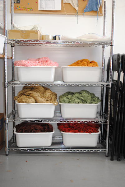 Bins of hand-dyed yarn