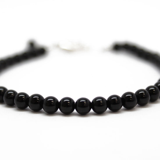 Black Onyx Bracelet | Om Mani Padme Hum Bracelet Engraved 10 mm Beads –  Reshamm Crystal Vastu