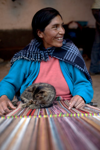 Quechua weaver and cat- a timeless tradition