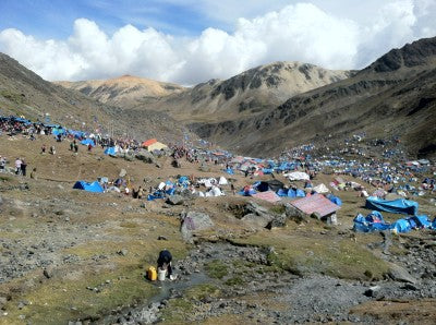 Viewed from above, the tent-covered valley.