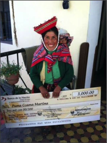 Here, Martina smiles enormously as she displays her enormous check!