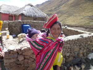 Maria Quispe carries Molly on her back. (July 2010)