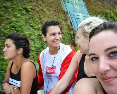 Volunteers Stephanie, Giuia, Eliane and Alexa riding in the back of a pickup truck in Quillabamba. Photography by Alexa Jones