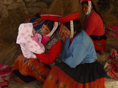 Hermenhilda and Turibia  curiously examining baby Molly!