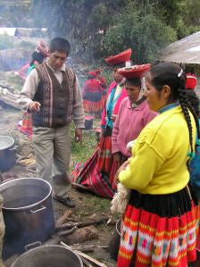 Master Weaver, Daniel Sonqo, instructing women on natural dying techniques.