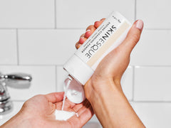 adding Enzyme Cleansing Powder to palm of hand