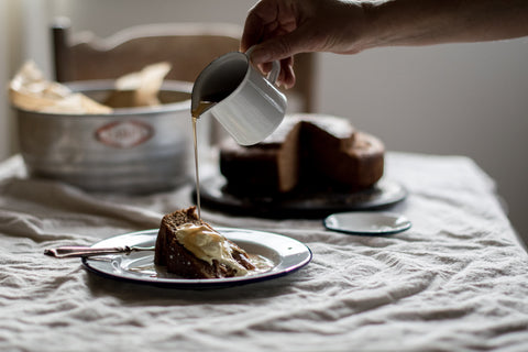 Rosehip syrup poured on Spiced Rosehip and Olive Oil Cake