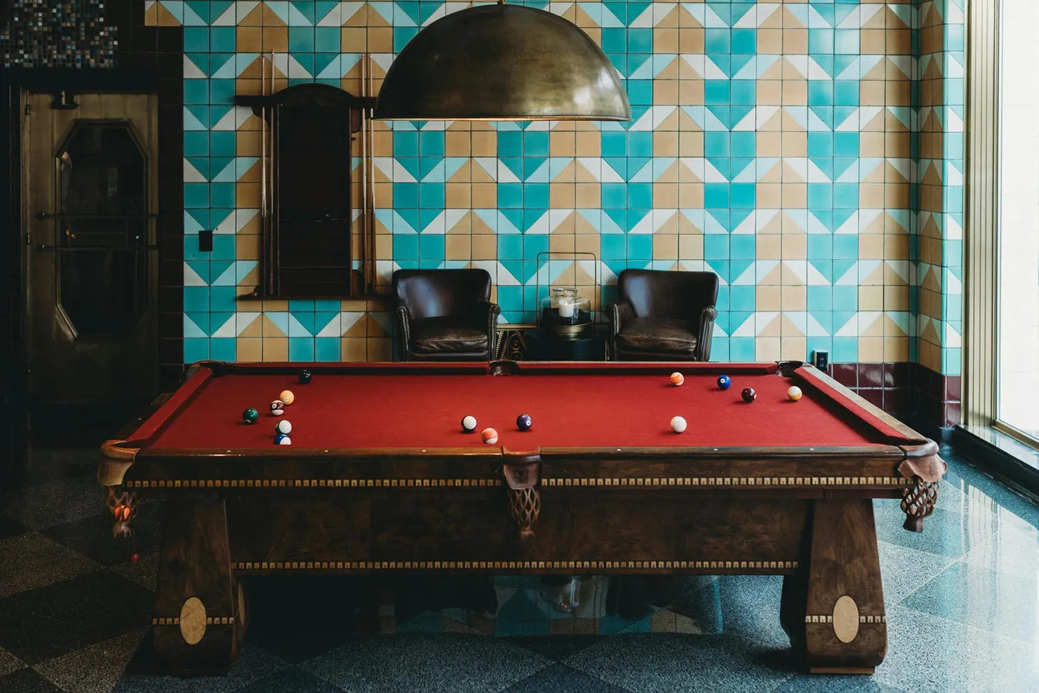 Luxury game room with leather chairs and high end pool table