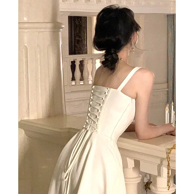 Elegant White Midi Dress with Sleeveless Lace-Up Detail