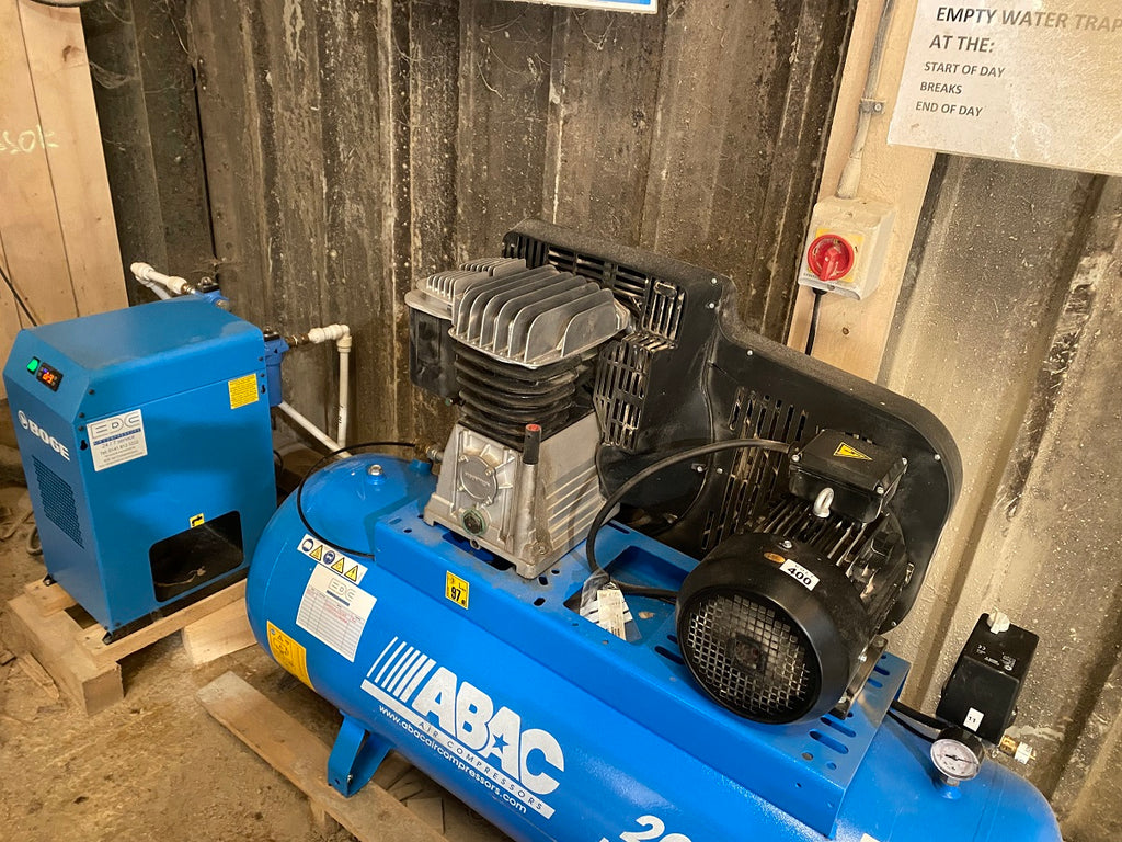 edc air compressor engineers servicing an ABAC compressor