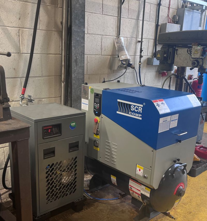an SCR air compressor and a dryer installed in a workshop