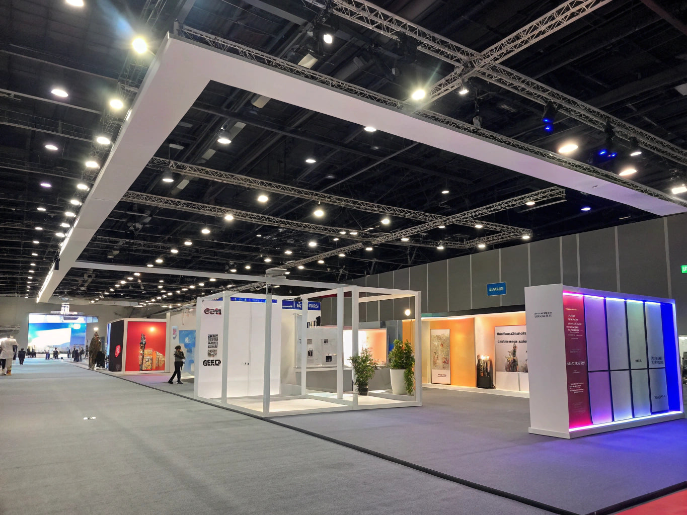 Bright expo hall with abstract modular structures, colorful LED lighting, and geometric frames.