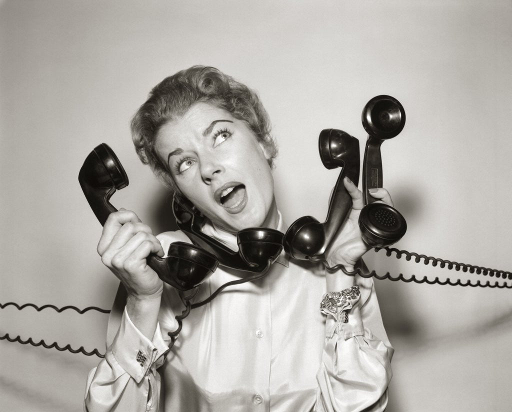 1950s 1960s Overwhelmed Stressed Woman Answering Four Black Telephone ...