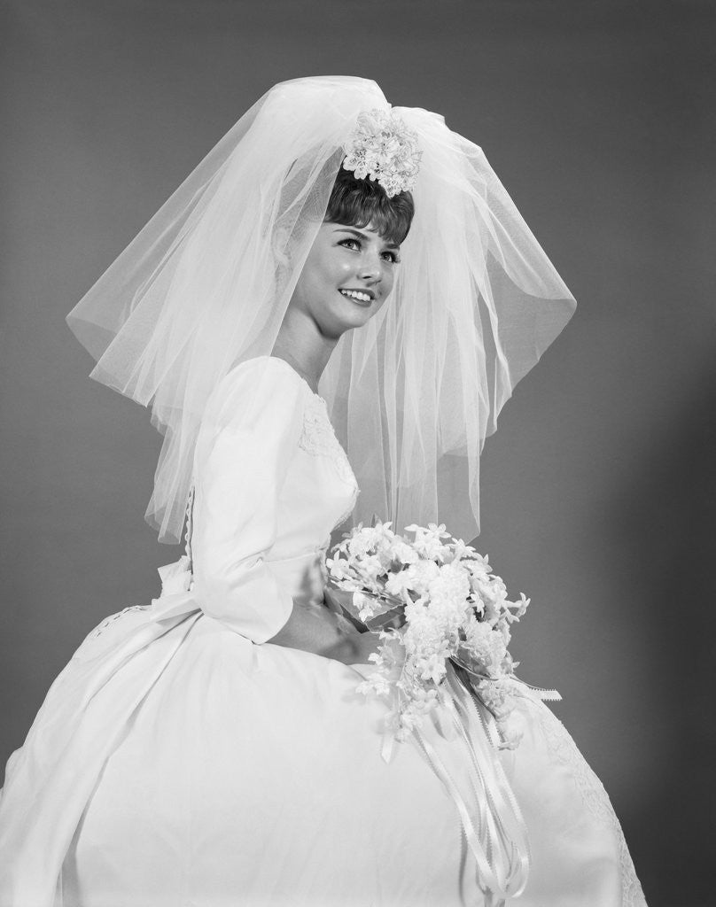 1960s bride portrait in wedding dress veil bridal bouquet posters