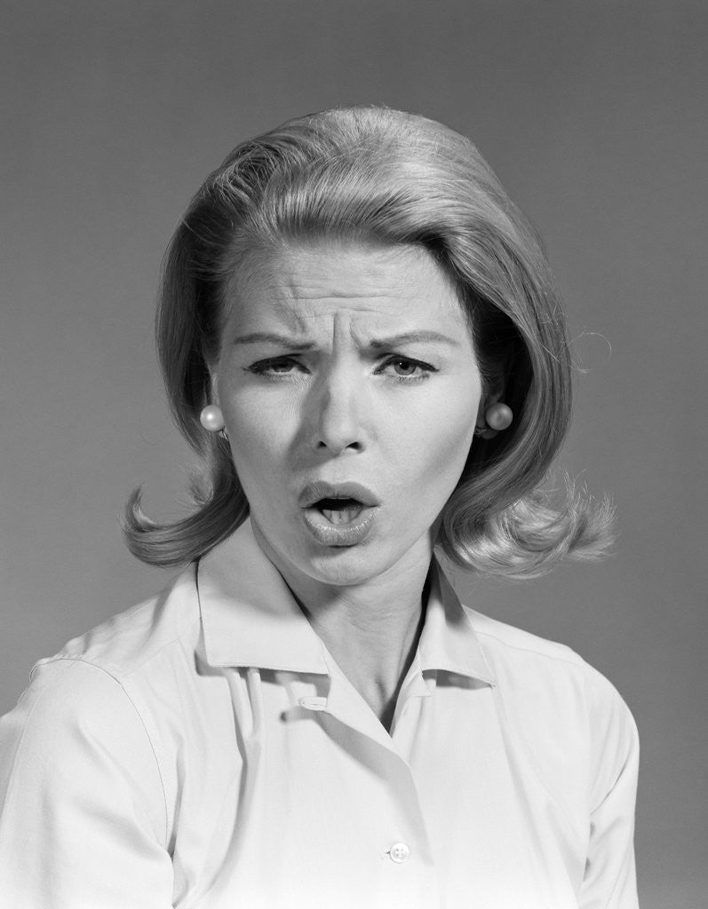 1960s woman blond hair in flip looking at camera mouth open angry mad ...