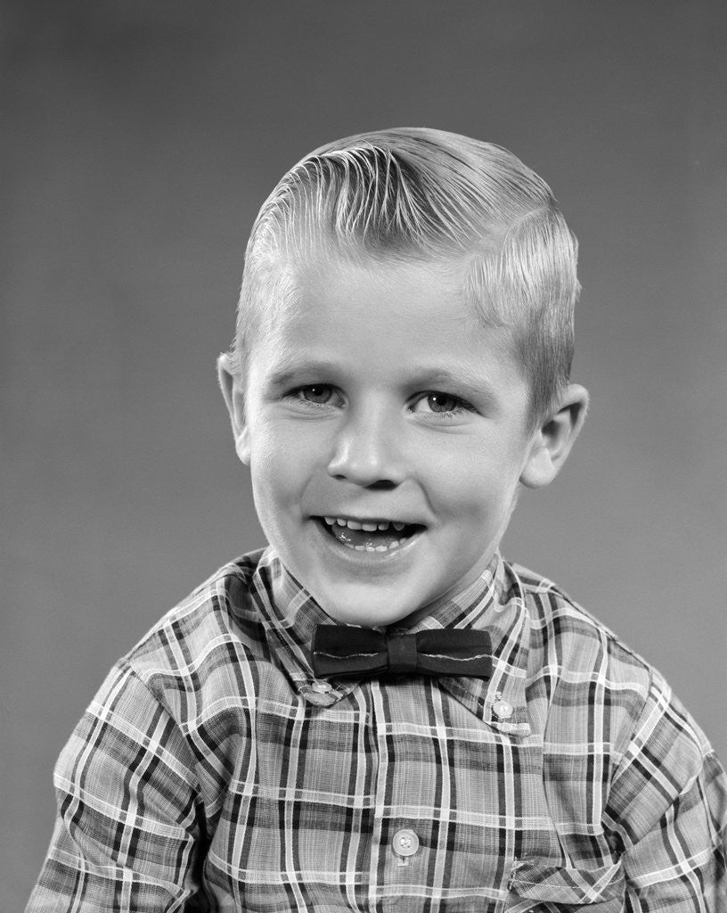 1950s smiling blond boy wearing plaid shirt bow ties looking at camera ...