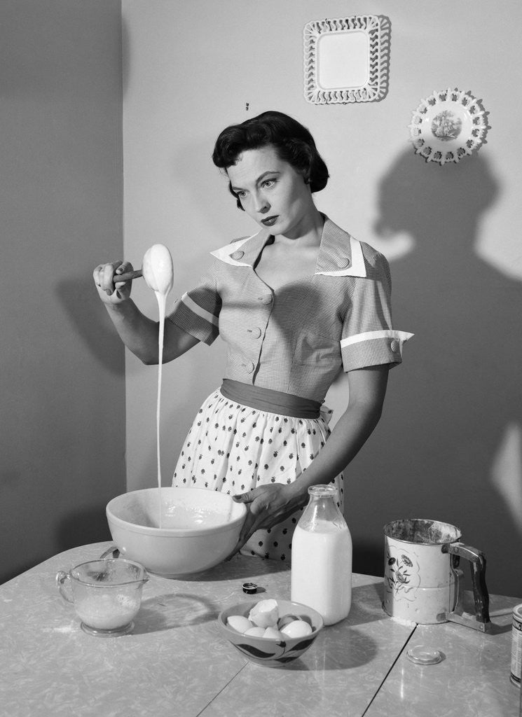 1950s Housewife Mixing Sticky Batter In Kitchen Posters