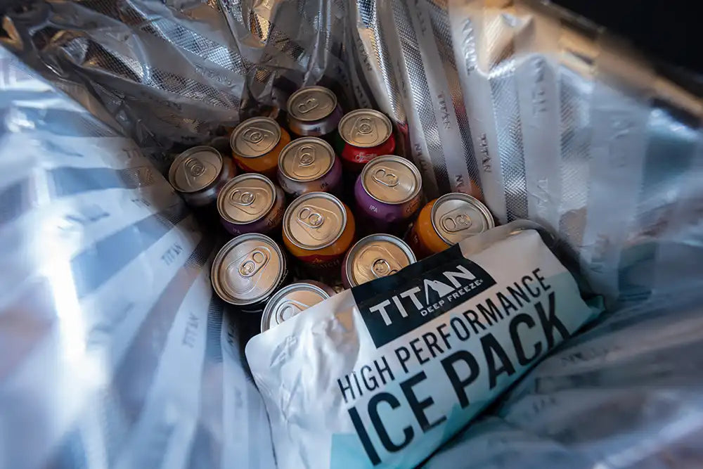 Interior shot of the Titan 40 Can Collapsible Cooler filled with pop cans and a reusable ice pack