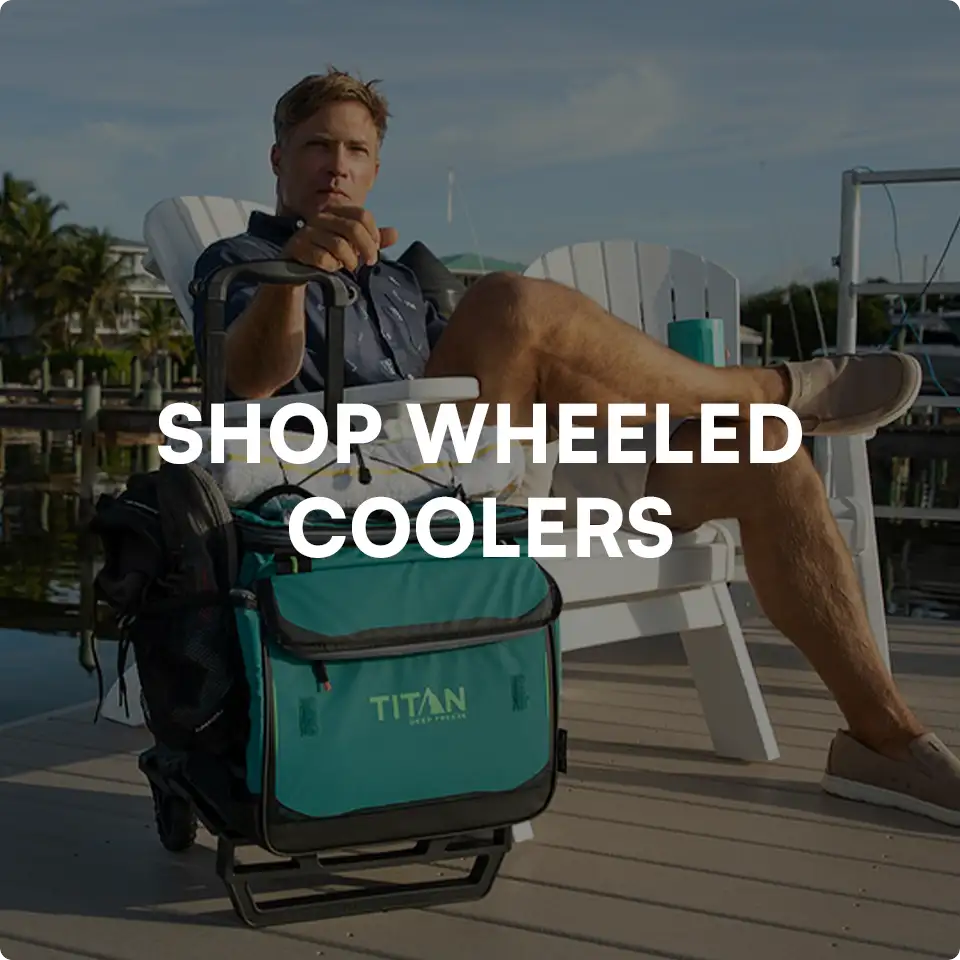 Man enjoying his coffee next to a wheeled cooler