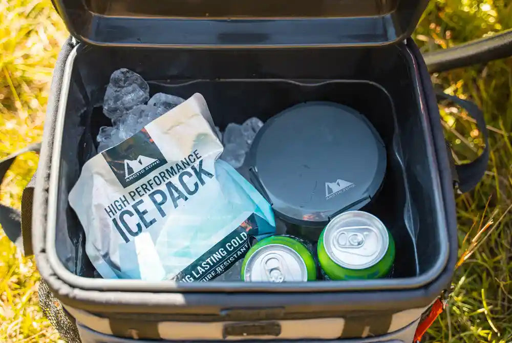 Soft cooler filled with drinks, ice and ice packs