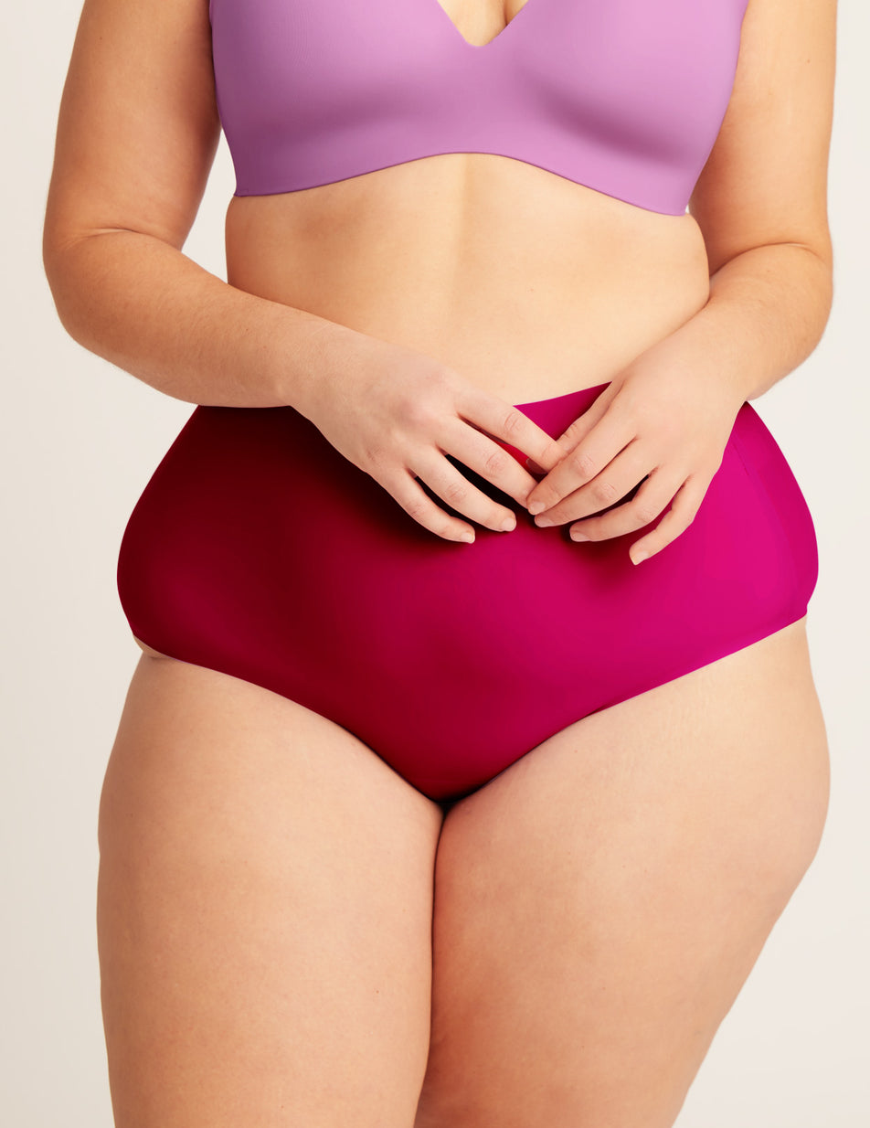 Geneve has 47" hips and wears a Knix size XL color:cerise