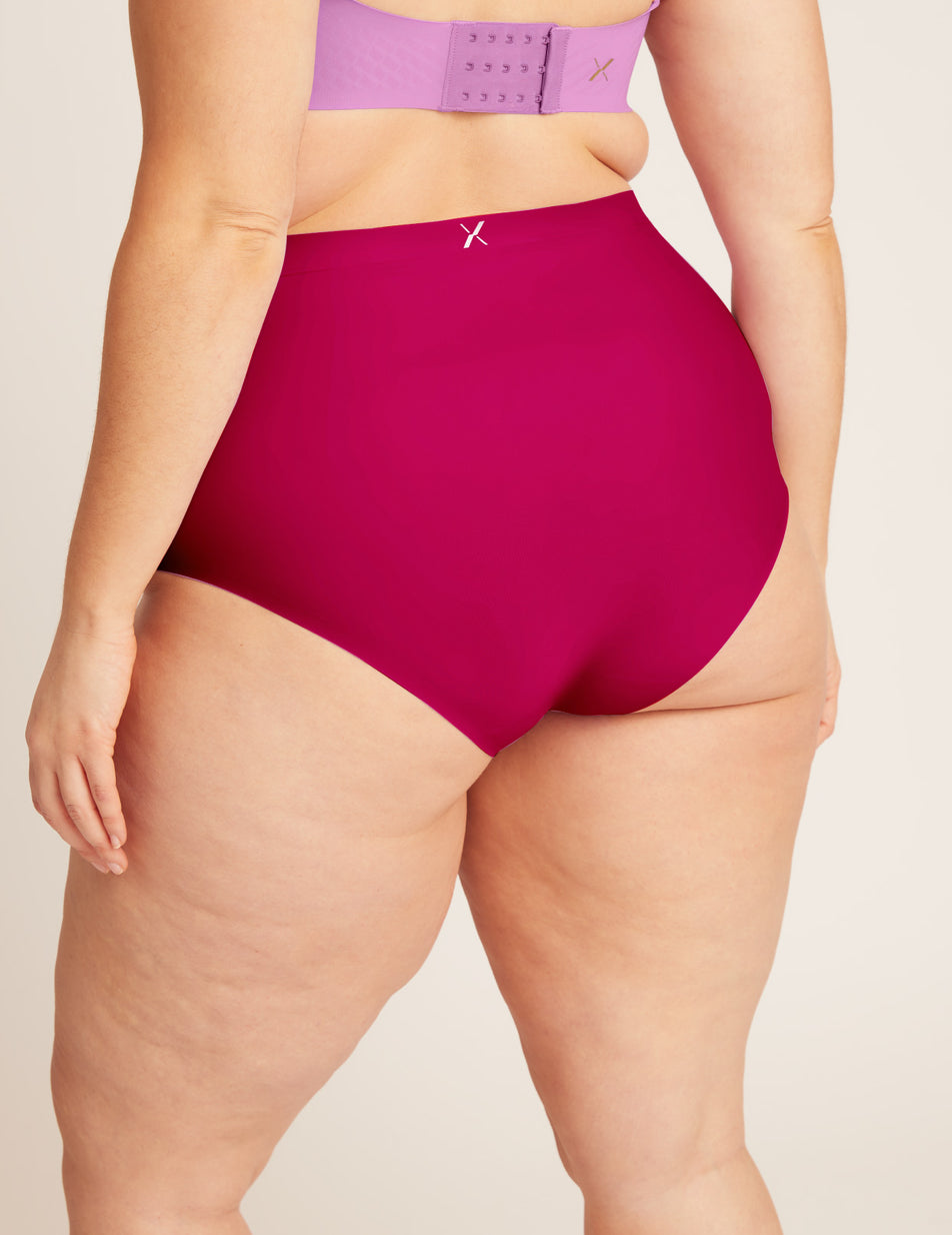 Geneve has 47" hips and wears a Knix size XL color:cerise