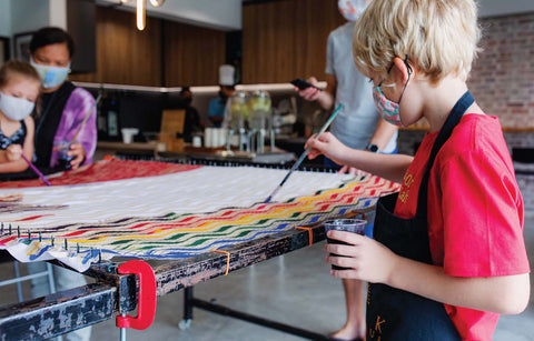 Kid enjoying DIY batik workshop