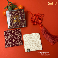 In celebration of the collaboration between Grand Hyatt and Batik Boutique, a red coaster featuring the Crimson Celestial pattern is showcased against a vibrant red background