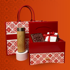 Explore the exquisite Set B from the collaboration between Batik Boutique and Grand Hyatt, showcasing an ensemble of delights, including authentic batik coasters and a wooden tumbler, a stylish tote bag, jewelry box, and a box of delectable chocolate pralines