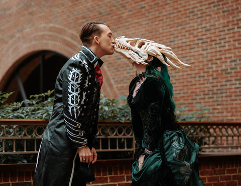 Kate & Baxter at their covid delayed gothic halloween dinosaur wedding at the North Carolina Museum of Natural Sciences