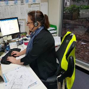 Elaine at her desk for long hours in her managerial role in Melbourne