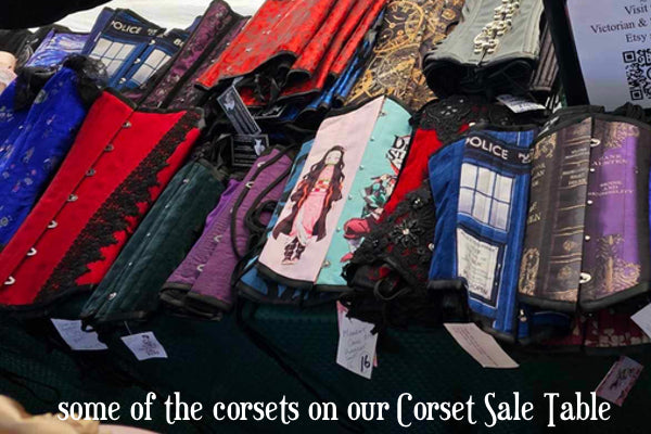 sale table of Australian made corsets at Gallery Serpentine and Victorian and Steampunk stall at Winterfest Medieval Fayre Sydney 2023