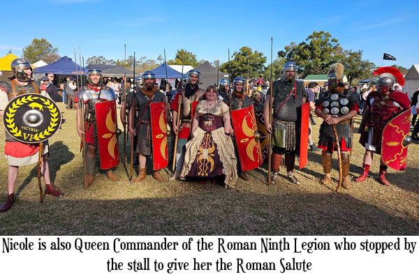 The Roman Ninth Legion re-enactment group after giving a Roman Salute to their Queen Commander Nicole Kirkwood wearing her custom made 9th Legion corset gown by Gallery Serpentine