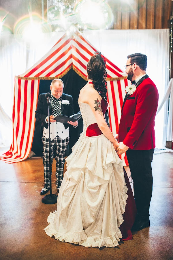 The wedding ceremony by a costumed celebrant in theme with The world's greatest showman for Julia and Curtis' wedding in the US