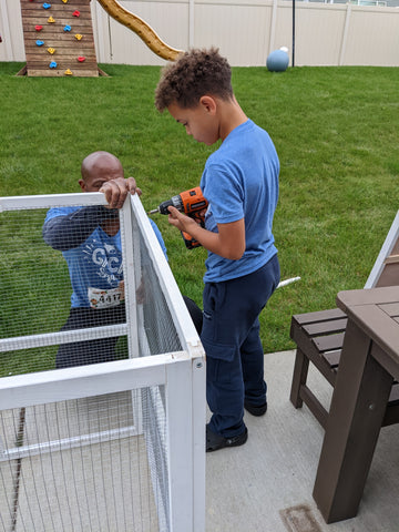 Kids building a chicken coop