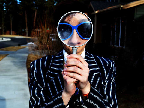 someone holding a magnifying glass