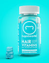 A bottle of SugarbearPRO Hair Vitamin Gummies displayed on a teal background