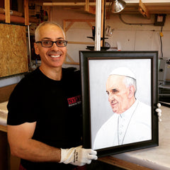 Portrait painting of Pope Francis by Oscar Lopez Rivera framed at Frames and Stretchers.