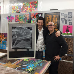 Ryan McGinnes and Erick from Frames and Stretchers with the framed artwork