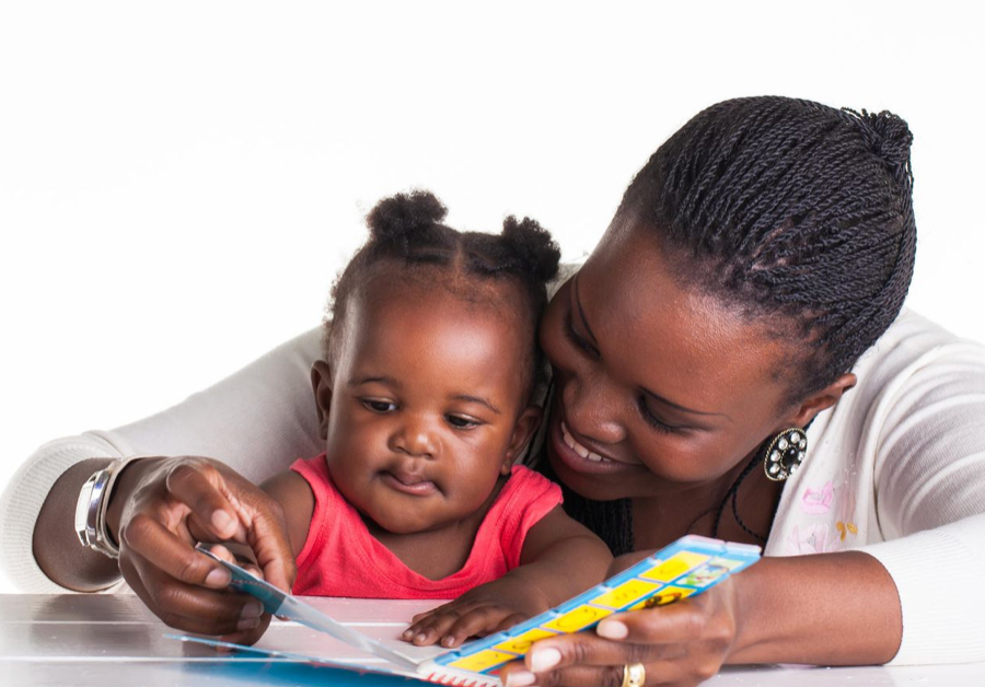 mom reading to her baby