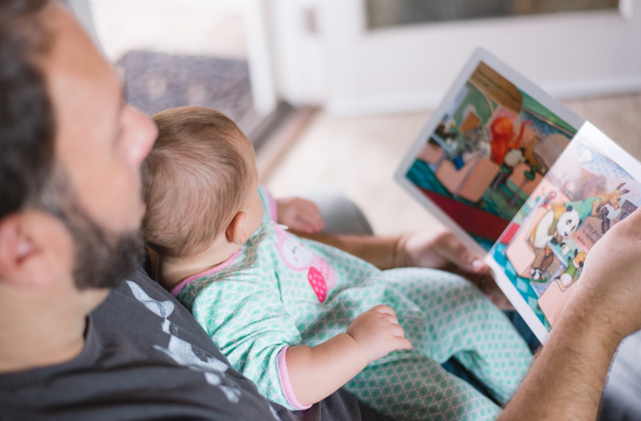 dad reading to baby