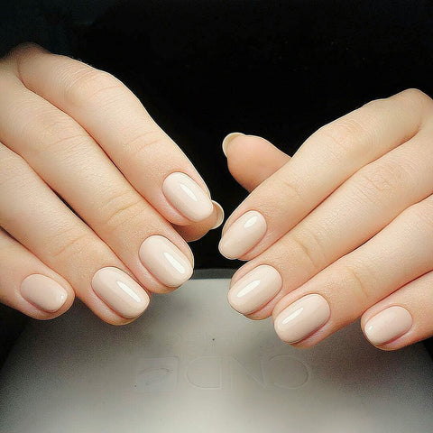 beautiful almond shape nails in cream color