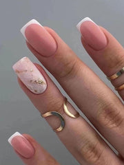 Womans very square shaped fingernails with sheer pink polish and nail design