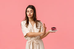 Woman looking like she's saying no to a dessert