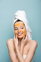 woman with orange face mask, turmeric, curcumin