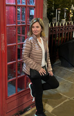 Kelli Parisian standing next to a red british phone booth