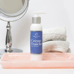 Parisians Pure Indulgence Creme fraiche face cleanser with face cloth on bathroom counter