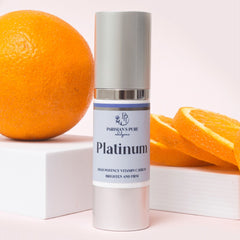 Parisians Pure Indulgence Platinum High Potency Vitamin C Serum surrounded by oranges representing Vitamin C - anti-aging