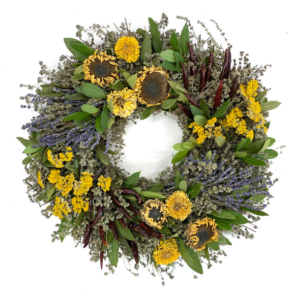 Our Sunflower and Herb Dried and Preserved is available in 2 sizes, 18” and 22” and handcrafted here in the USA from all hand grown and picked florals which have been dried to perfection. It does include a few fresh natural ingredients as well.  This is the 22" size wreath